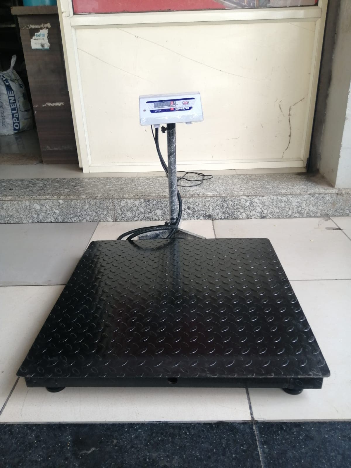 Heavy-duty chequered-plate platform scale with digital indicator, supplied by OM Marketing